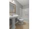 Stylish bathroom features a pedestal sink with a large framed mirror and bathtub at 2011 Coldspring Dr # B, North Charleston, SC 29406