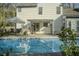Beautiful in-ground swimming pool with patio and outdoor seating area with a pergola at 203 Candleberry Cir, Goose Creek, SC 29445