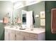 Bright bathroom features double vanity with framed mirror and neutral paint color at 203 Candleberry Cir, Goose Creek, SC 29445