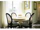 Bright dining area features a round table, four chairs, and natural light at 203 Candleberry Cir, Goose Creek, SC 29445