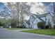 Traditional home with manicured lawn, two-car garage, and classic architectural details at 203 Candleberry Cir, Goose Creek, SC 29445