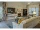 Spacious living room featuring modern decor, large windows, and a comfortable seating arrangement at 203 Candleberry Cir, Goose Creek, SC 29445