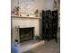 Cozy living room features white brick fireplace and oriental decorative screen at 203 Candleberry Cir, Goose Creek, SC 29445