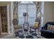 Cozy sitting area with patterned chairs, natural light, and stylish accents at 203 Candleberry Cir, Goose Creek, SC 29445