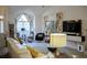 Cozy living area with cathedral ceiling, decorative floral curtains, and contemporary furnishings at 203 Candleberry Cir, Goose Creek, SC 29445