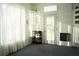 Sun room with natural light, shelves, and a back door for outdoor access at 203 Candleberry Cir, Goose Creek, SC 29445