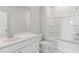 Bright bathroom showcasing a large mirror, vanity, and a shower over tub combination at 217 Denham St, Summerville, SC 29486
