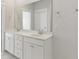 Bathroom featuring dual sinks, large vanity mirror, and modern cabinets at 217 Denham St, Summerville, SC 29486