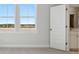 Bright bedroom featuring neutral walls, modern carpet, and plenty of sunlight from multiple windows at 217 Denham St, Summerville, SC 29486