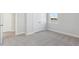 Bedroom showcasing plush carpeting and a window offering scenic water views at 217 Denham St, Summerville, SC 29486