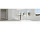 Bright hallway featuring neutral walls, modern carpet, and plenty of sunlight from multiple windows at 217 Denham St, Summerville, SC 29486