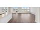 Open concept living room with luxury vinyl floors, large windows, and access to the water at 217 Denham St, Summerville, SC 29486