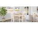 Cozy dining area with a wooden table, natural light, and seamless flow to the kitchen, perfect for Gathering meals at 223 Denham St, Summerville, SC 29486