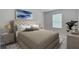 Calm main bedroom with a tufted headboard, soft lighting, and tasteful decor, creating a restful atmosphere at 223 Denham St, Summerville, SC 29486