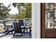 Relaxing balcony with stylish Adirondack chairs and a small table, offering a perfect spot to enjoy the outdoors at 29 27Th Ave, Isle of Palms, SC 29451