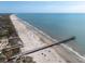 Expansive beach view with a pier and clear blue waters, ideal for coastal living and recreation at 29 27Th Ave, Isle of Palms, SC 29451