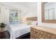 Inviting bedroom with a queen bed, natural light, and stylish wooden dresser at 29 27Th Ave, Isle of Palms, SC 29451