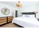 Bright bedroom features a queen bed, natural light, two nightstands, and minimalist decor at 29 27Th Ave, Isle of Palms, SC 29451