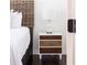 Close up of a well-appointed bedroom with a unique headboard and a three-drawer nightstand at 29 27Th Ave, Isle of Palms, SC 29451