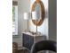 Console table features decorative lamps and a round woven mirror at 29 27Th Ave, Isle of Palms, SC 29451