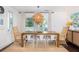 Dining room has a wooden table with seating and natural light at 29 27Th Ave, Isle of Palms, SC 29451