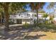 Charming two-story home boasts a wrap-around porch, lush landscaping, and a two-car garage at 29 27Th Ave, Isle of Palms, SC 29451