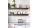 Elegant kitchen features open wood shelves, white subway tiles, marble countertops, and stainless steel appliances at 29 27Th Ave, Isle of Palms, SC 29451