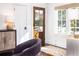 Bright living room with an accent chair, decorative lamps, and a stylish rug near a glass paneled door at 29 27Th Ave, Isle of Palms, SC 29451