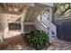 Charming outdoor patio with brick pavers, stairs to backyard and lush greenery around the property at 29 27Th Ave, Isle of Palms, SC 29451
