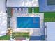 A birds-eye view shows the pool, patio and a basketball court in the backyard of this modern home at 299 Bampfield Dr, Mount Pleasant, SC 29464
