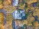 An aerial view of a modern home features a pool, basketball court and beautiful surrounding trees at 299 Bampfield Dr, Mount Pleasant, SC 29464