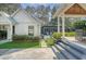 Beautifully landscaped backyard with stone pathways, lush greenery, and outdoor structures at 299 Bampfield Dr, Mount Pleasant, SC 29464