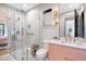 Modern bathroom with glass-enclosed shower, pink vanity, and elegant fixtures at 299 Bampfield Dr, Mount Pleasant, SC 29464
