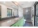 Modern bathroom with green vanity, dark countertop, and glass enclosed shower at 299 Bampfield Dr, Mount Pleasant, SC 29464