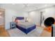 Cozy bedroom featuring a blue bed frame, soft lighting, and modern decor at 299 Bampfield Dr, Mount Pleasant, SC 29464