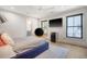Bright bedroom featuring neutral walls, modern black fixtures, and an orange chair at 299 Bampfield Dr, Mount Pleasant, SC 29464