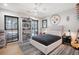 Bedroom featuring large windows, light walls, and unique sports decor at 299 Bampfield Dr, Mount Pleasant, SC 29464