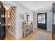 Stylish entryway showcasing shiplap walls, a decorative mirror, and a hallway leading to a powder room at 299 Bampfield Dr, Mount Pleasant, SC 29464