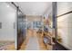 Inviting entryway featuring a sliding barn door, light hardwood floors, and a glimpse of the living room at 299 Bampfield Dr, Mount Pleasant, SC 29464