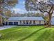 A bright and inviting home showcasing a lush green lawn and a relaxing front porch at 299 Bampfield Dr, Mount Pleasant, SC 29464