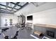 Bright home gym with fitness equipment, wall-mounted TV, and a modern, industrial-style ceiling at 299 Bampfield Dr, Mount Pleasant, SC 29464