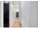 Hallway featuring wood floors, white wood paneling, and black doors at 299 Bampfield Dr, Mount Pleasant, SC 29464