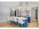Modern kitchen features blue island with seating, white countertops, and stainless steel appliances at 299 Bampfield Dr, Mount Pleasant, SC 29464