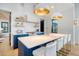 Open kitchen with blue cabinets, a spacious island, and modern appliances under vaulted ceilings at 299 Bampfield Dr, Mount Pleasant, SC 29464