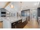 Open concept kitchen with black cabinets, marble countertops, and stainless steel refrigerator at 299 Bampfield Dr, Mount Pleasant, SC 29464