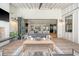 Relaxing living room features a fireplace, ceiling fan and an open folding glass door at 299 Bampfield Dr, Mount Pleasant, SC 29464
