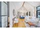 Bright open-concept living room with high ceilings, modern furnishings, and seamless kitchen view at 299 Bampfield Dr, Mount Pleasant, SC 29464