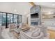 Open-concept living room with a fireplace, comfortable seating, and large windows at 299 Bampfield Dr, Mount Pleasant, SC 29464