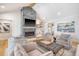 Bright living room featuring a stone fireplace, hardwood floors, and comfortable seating at 299 Bampfield Dr, Mount Pleasant, SC 29464