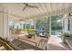 Covered outdoor patio features comfortable seating and dining area, along with scenic backyard views at 299 Bampfield Dr, Mount Pleasant, SC 29464